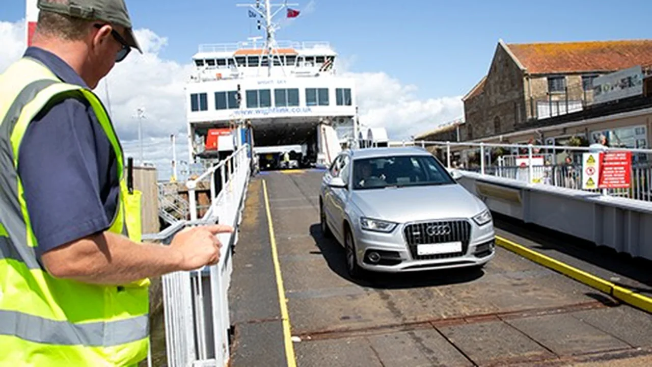 Car leaving a Wightlink ferry at the terminal